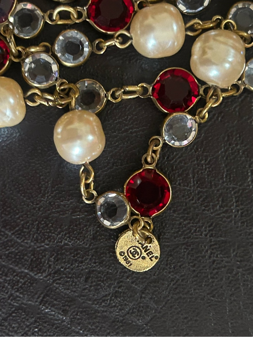 CHANEL Gold-Tone Pearl Necklace with Red and Clear Stones
